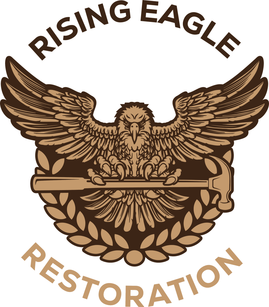 Logo of Rising Eagle Restoration in brown, featuring an eagle holding a hammer within a laurel wreath and the company name.